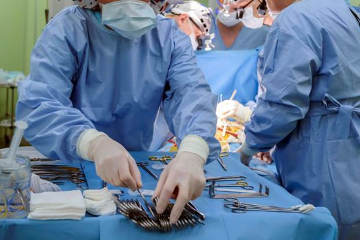 Surgical instruments in operating room on table.