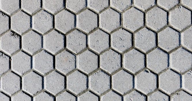 The black and white background image of hexagonal clay tiles