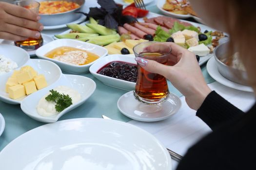 Organic, fresh traditional turkish village breakfast on wooden table with copper egg pan