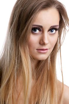 Pretty blond girl with long hair look at you - close-up portrait