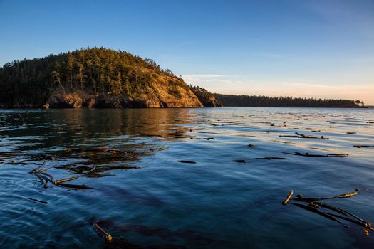 Landscape view on the Pacific Ocean during a winter sunset. Picture taken near Deception Pass, Washington, USA.
