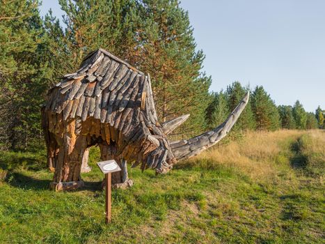 KARGOPOL, RUSSIA - September 10, 2018. Wooden statue of rhinoceros in park named Path of anthills.