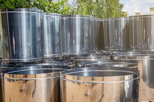 Ventilation pipe warehouse. Steel pipes, parts for the construction of air ducts for an industrial air conditioning system in a warehouse. Industrial airway ventilation equipment and piping systems.