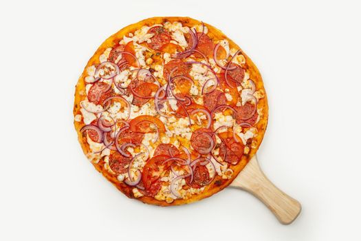 Delicious Rustic pizza. Signature sauce, mozzarella cheese, pepperoni, chicken fillet, tomatoes, red onion. Close-up. Advertising flyer and poster for restaurants. With copy space for text