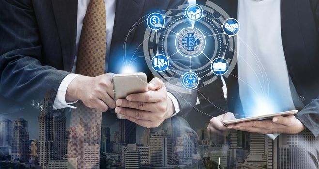 Bitcoin and cryptocurrency investing concept - Businessman using mobile phone application to trade Bitcoin BTC with another trader in modern graphic interface. Blockchain and financial technology.