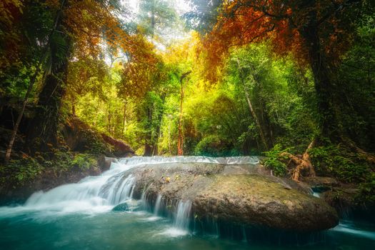 Waterfall in deep tropical jungle in autumn.
