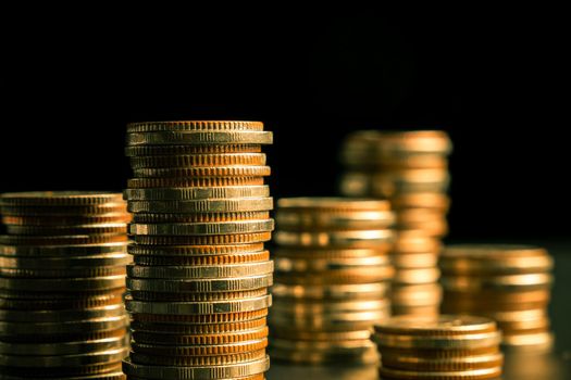 Pile of gold coins stack in finance treasury deposit bank account for saving . Concept of corporate business economy and financial growth by investment in valuable asset to gain cash revenue profit .