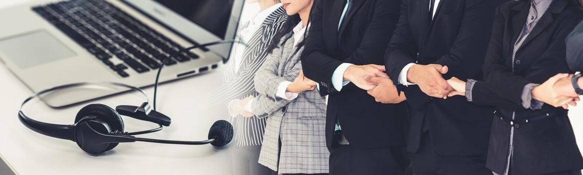 Successful business people standing together showing strong relationship of worker community. A team of businessman and businesswoman expressing a strong group teamwork at office broaden view