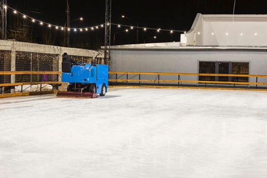 machine leveling the ice on the skating rink