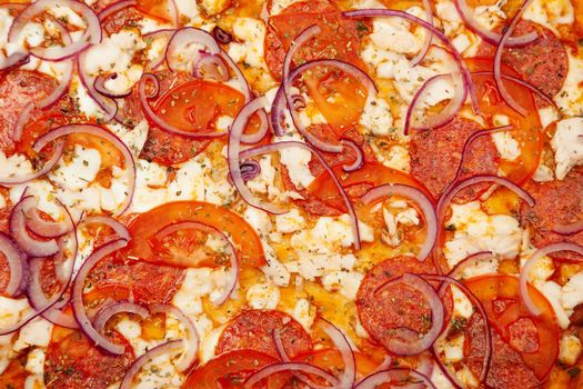 Tasty rustic pizza texture. Signature sauce, mozzarella cheese, pepperoni, chicken fillet, tomatoes, red onion. Close-up. Advertising flyer and poster for restaurants. With copy space for text.