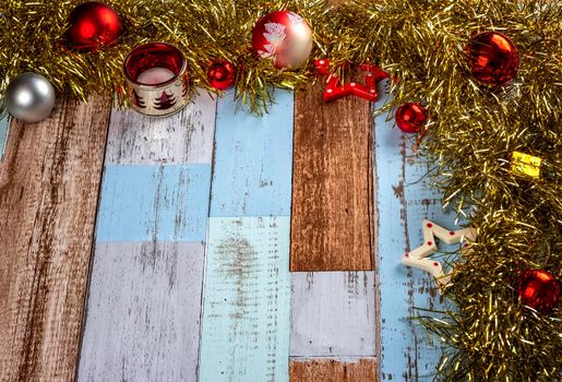 Christmas background with garlands and toys on a wooden canvas background. Merry Christmas card. 