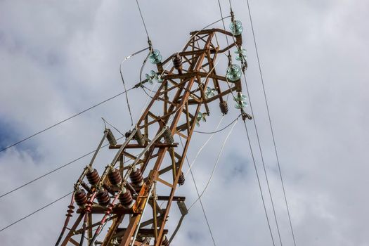High voltage electric pole and transmission lines. Electricity pylons. Power and energy engineering system. Cable wire on an electric post. 