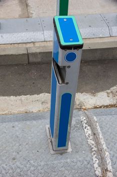 Empty bike sharing station. Modern blue bikes at city rental station on sunny day 