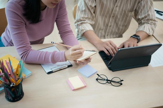 Close up startup employee consulting on office table.