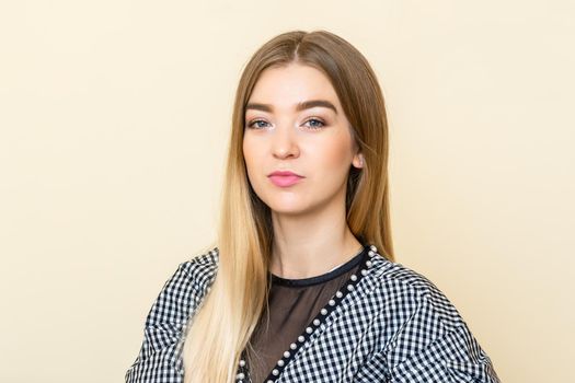 Portrait of a casual business woman sitting at her workplace in home office.