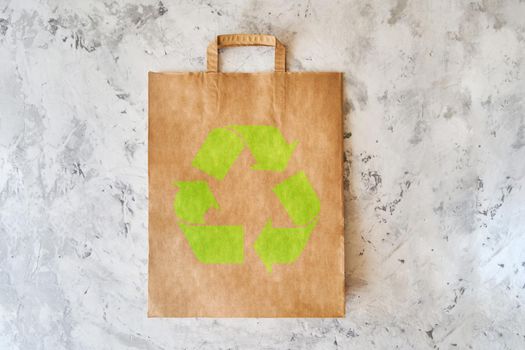 Blank eco brown paper bag on light background. Craft grocery bag. Mockup. Copy space