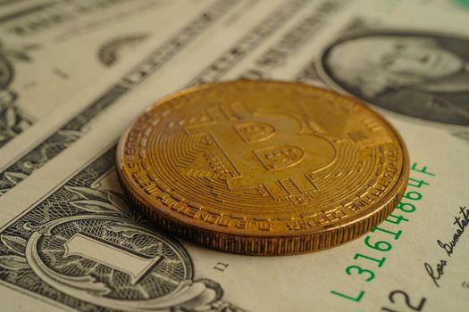 Golden bitcoin on US dollar banknotes money for business and commercial, Digital currency, Virtual cryptocurrency, blockchain technology.