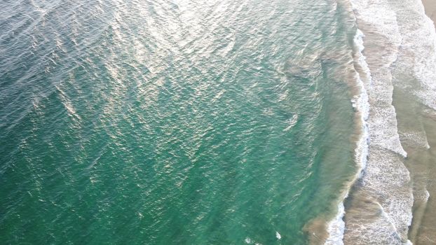 Aerial view of an emerald green sea and big foaming waves. Indian Ocean. Dikwella beach. Sri Lanka. High quality photo