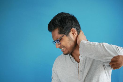 man suffering chronic neck pain .