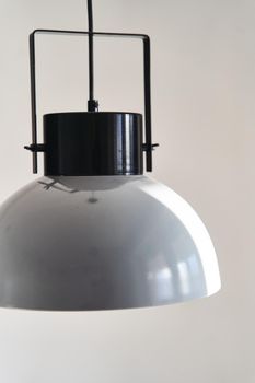 Modern gray loft chandelier. Interior decoration of stylish housing. Loft style incandescent lamp. Modern style home design.