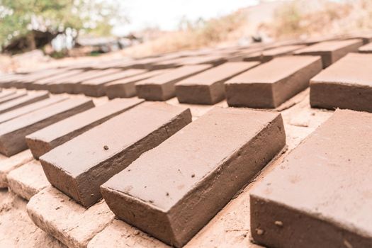 Clay bricks on the ground drying in the sun in an artisan workshop in La Paz Centro Nicaragua