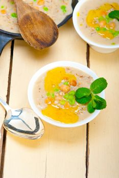 Hearty Middle Eastern Chickpea and Barley Soup with mint leaves on top