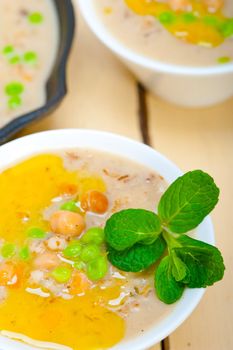 Hearty Middle Eastern Chickpea and Barley Soup with mint leaves on top