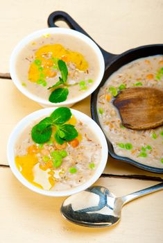 Hearty Middle Eastern Chickpea and Barley Soup with mint leaves on top