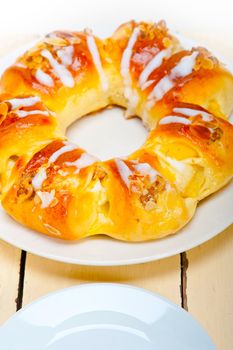 fresh home baked sweet bread donut cake with almonds and icing sugar on top