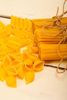 bunch of Italian pasta type on a white rustic table 