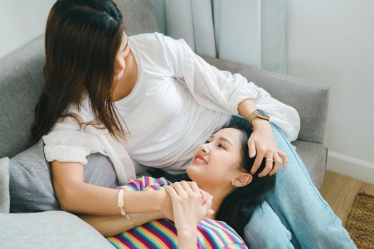 lgbtq, lgbt concept, homosexuality, portrait of two Asian women posing happy together and showing love for each other while being together.