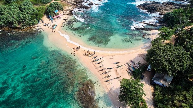 Aerial view of blue beach island. Drone view of the beaches of Sri Lanka. High quality photo