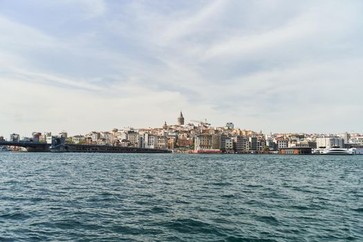 Istanbul, Turkey - May 9, 2021: View of the Galata Tower across the Bosphorus Bay from the Fatih area. Istanbul, Turkey. High quality photo