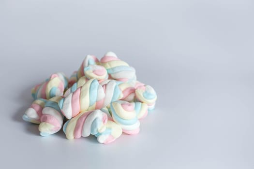 Colored twisted marshmallow on white