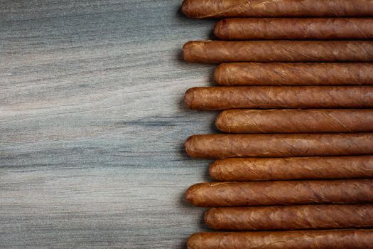 Cigars on the wooden background