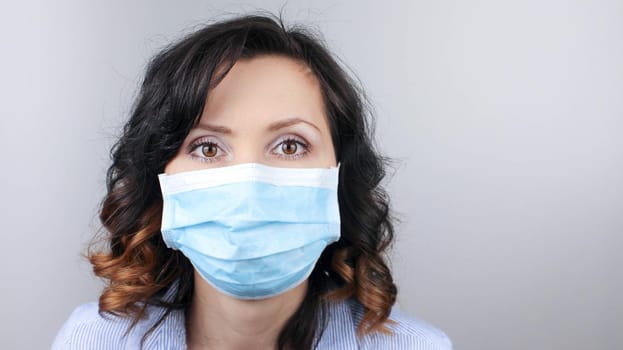 Woman wearing protection face mask against coronavirus. Woman in a mask and glasses. Medical mask, Close up shot, Select focus, Prevention from covid19