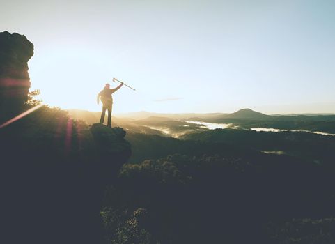 Man achieve the summit. Man on the peak alone with his minds, cloudy wheather