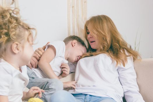 A loving woman with children. Happy family.