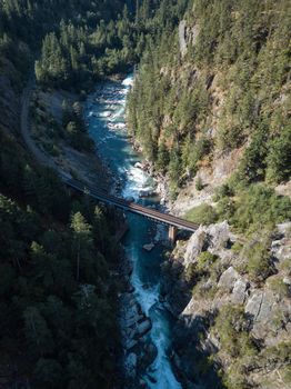 Aerial View of River flowing in canyon. Canadian Mountain Landscape, View from above. British Columbia, Canada. Nature Background