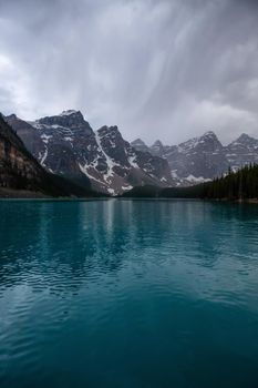 Canadian Rockies during a cloudy and rainy evening. Taken in Moraine Lake, Banff National Park, Alberta, Canada.