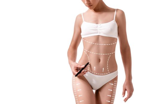 Female body with the drawing arrows on it isolated on white. Fat lose, liposuction and cellulite removal concept. Plastic surgery