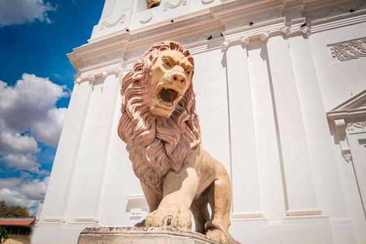 Monument of a lion, Lion statue near a church, lion statue in the city of León, lion cathedral