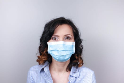 Woman wearing protection face mask against coronavirus. Woman in a mask and glasses. Medical mask, Close up shot, Select focus, Prevention from covid19
