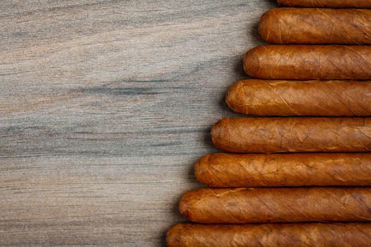 Cigars on the wooden background