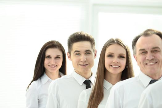 close up. a successful group of employees standing in a row.the concept of teamwork