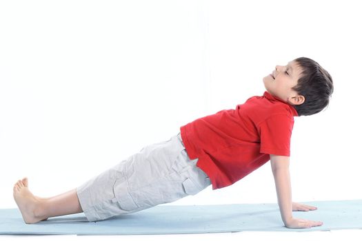 little boy performs morning health gymnastics.isolated on white.
