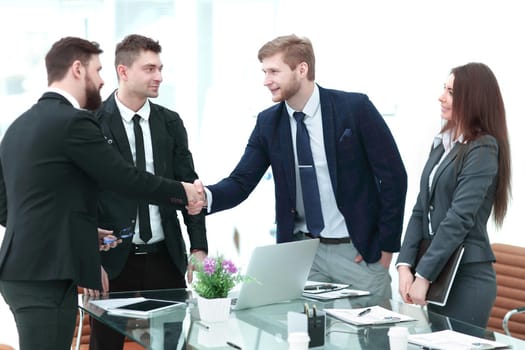 business woman greets the employee with a handshake,photo with copy space