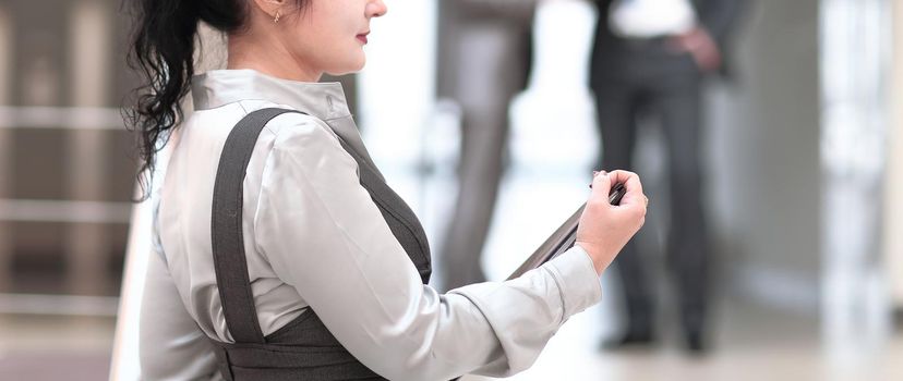 successful young business woman on blurred background office