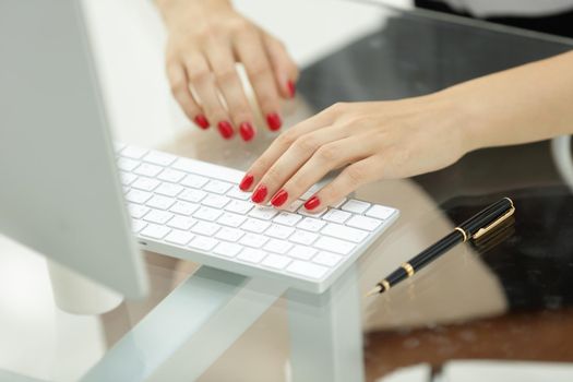 closeup.business woman typing text on the computer keyboard.people and technology