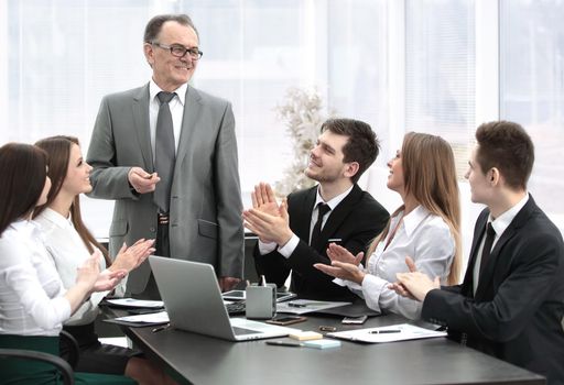 business team applauding leaders at the meeting.photo with copy space
